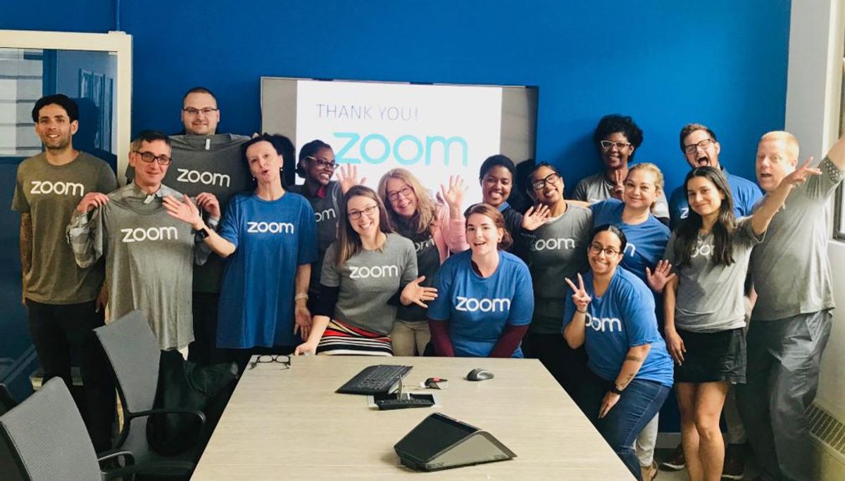 Zoom employees pose for a photo at the company's San Jose headquarters.