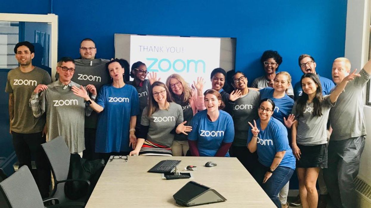 Zoom employees pose for a photo at the company's San Jose headquarters.