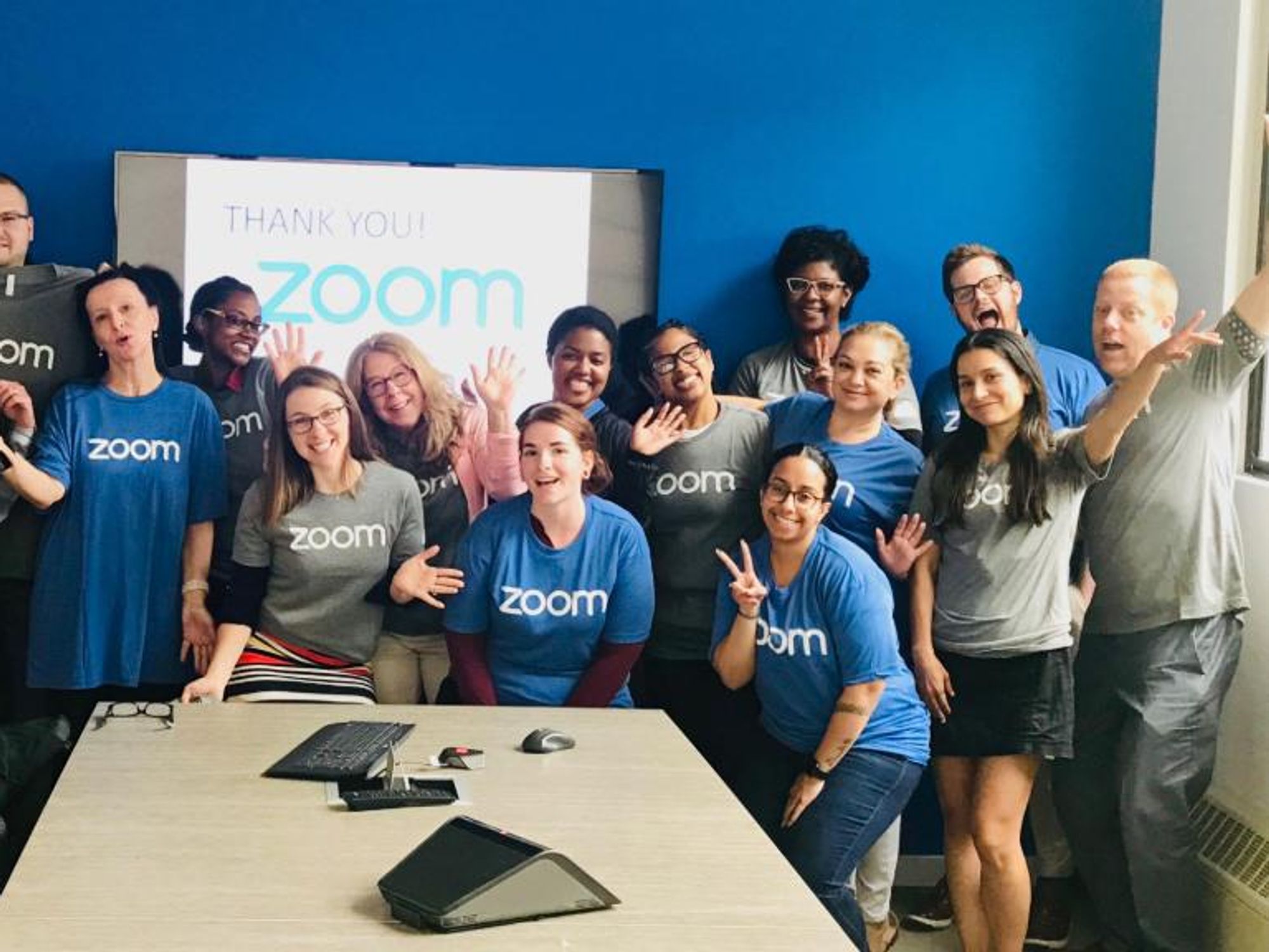 Zoom employees pose for a photo at the company's San Jose headquarters.